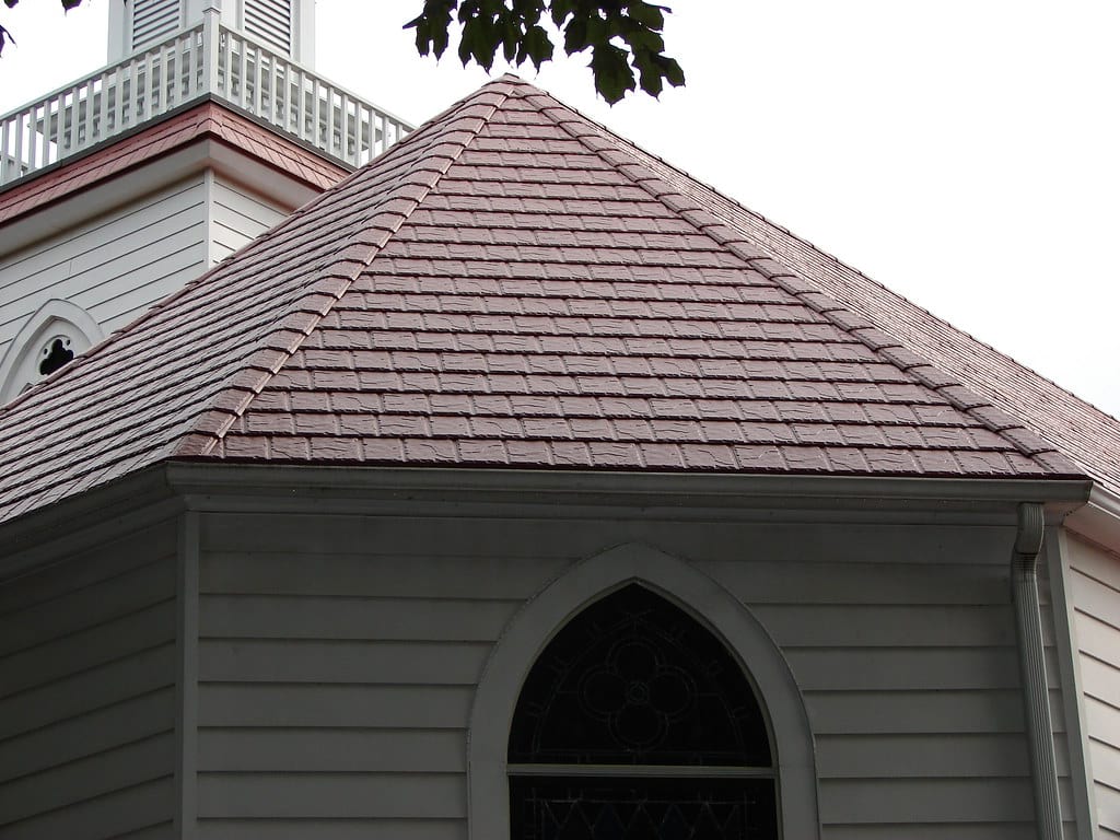 A home with red synthetic tile roofing.