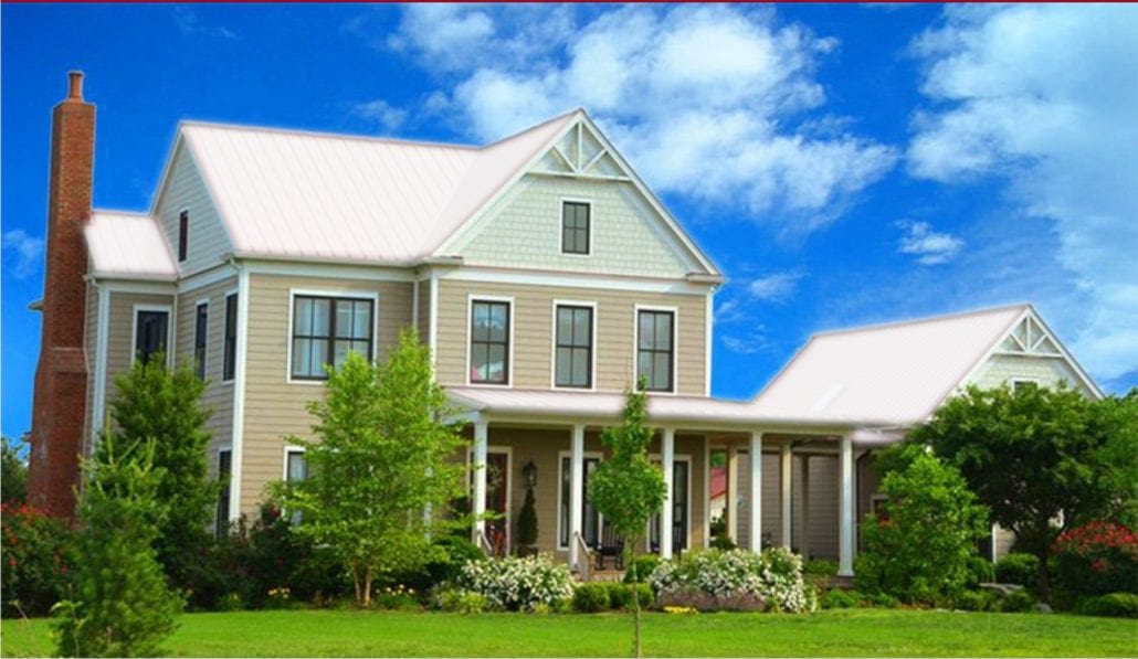 A large 3 story home with white metal residential roofing.