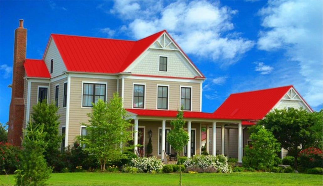 A large 3 story home with red metal residential roofing.