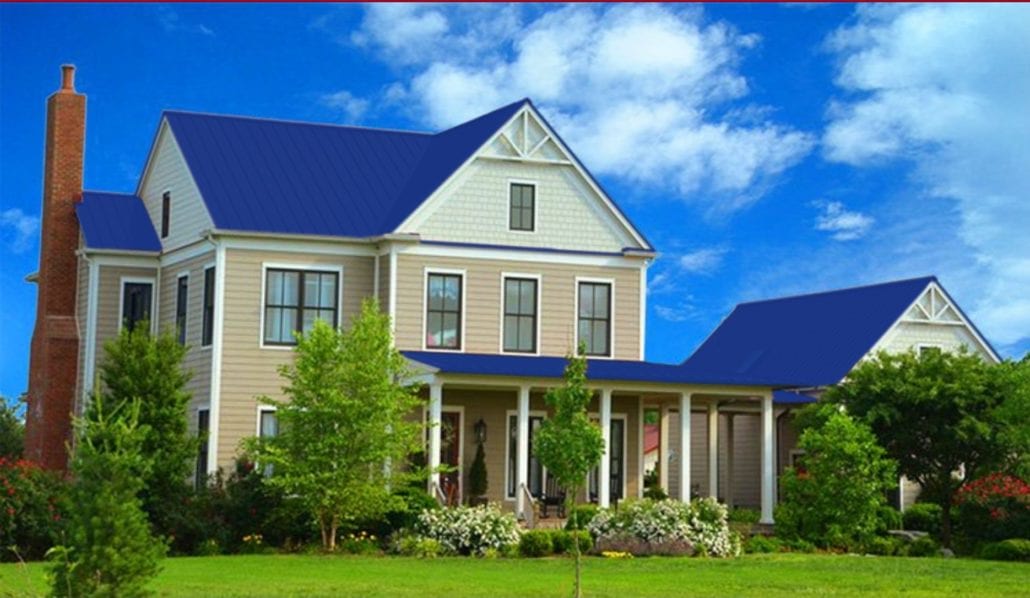 A large 3 story home with blue metal residential roofing.