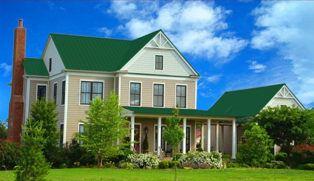 A large 3 story home with green metal residential roofing.