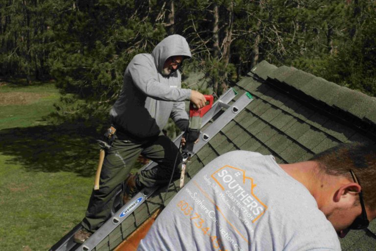 2 men working on an asphalt shingle roof in Sandown, NH.