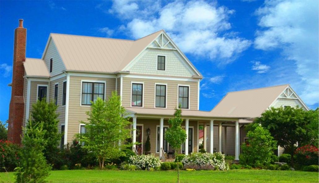 A large 3 story home with beige metal residential roofing.