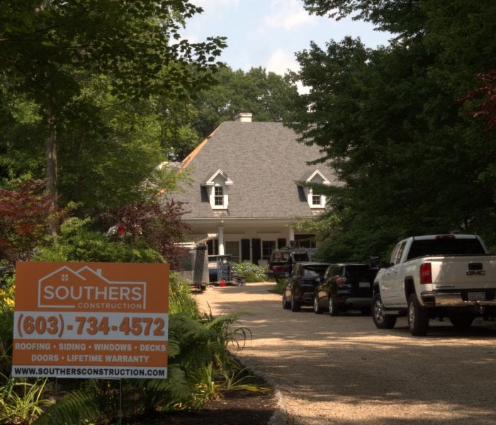 A Southers Construction sign placed next to the driveway of a home in West Newbury, MA.