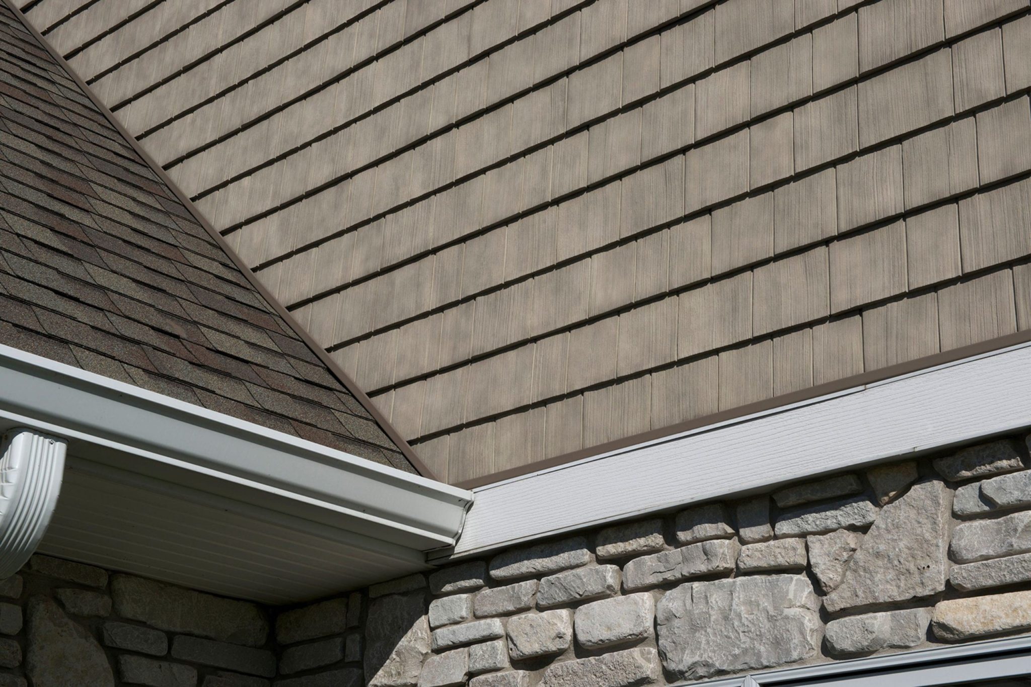 Tan TandoShake siding with TandoStone accenting.