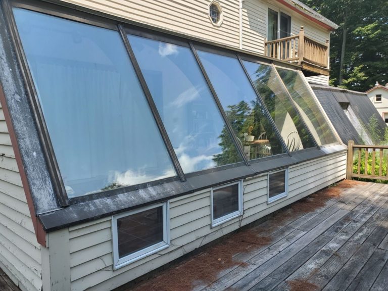 Angled windows on a home overlooking the deck.