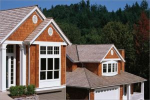 A home with cedar shake siding and white trim.