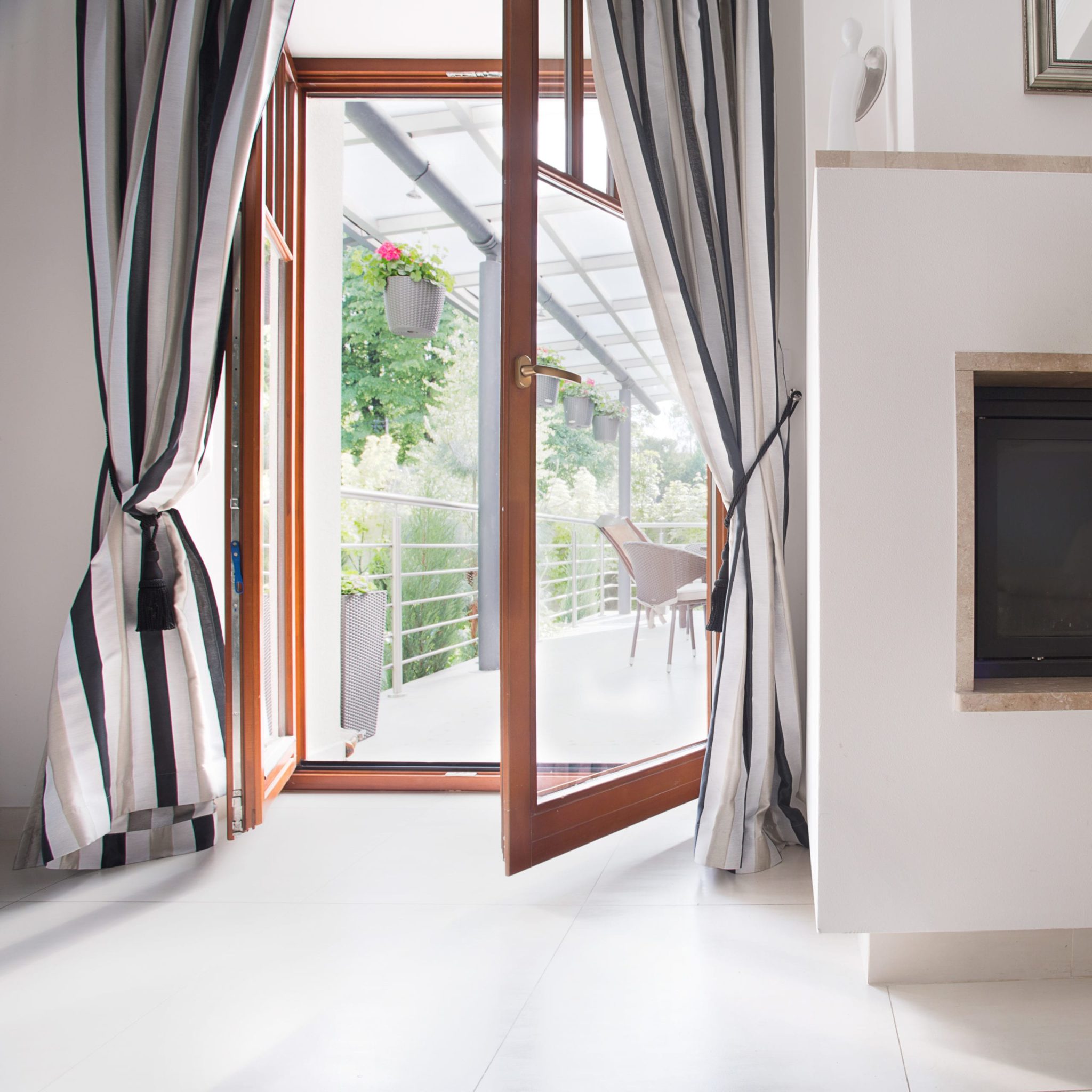 Double glass hinged patio doors leading to a balcony.