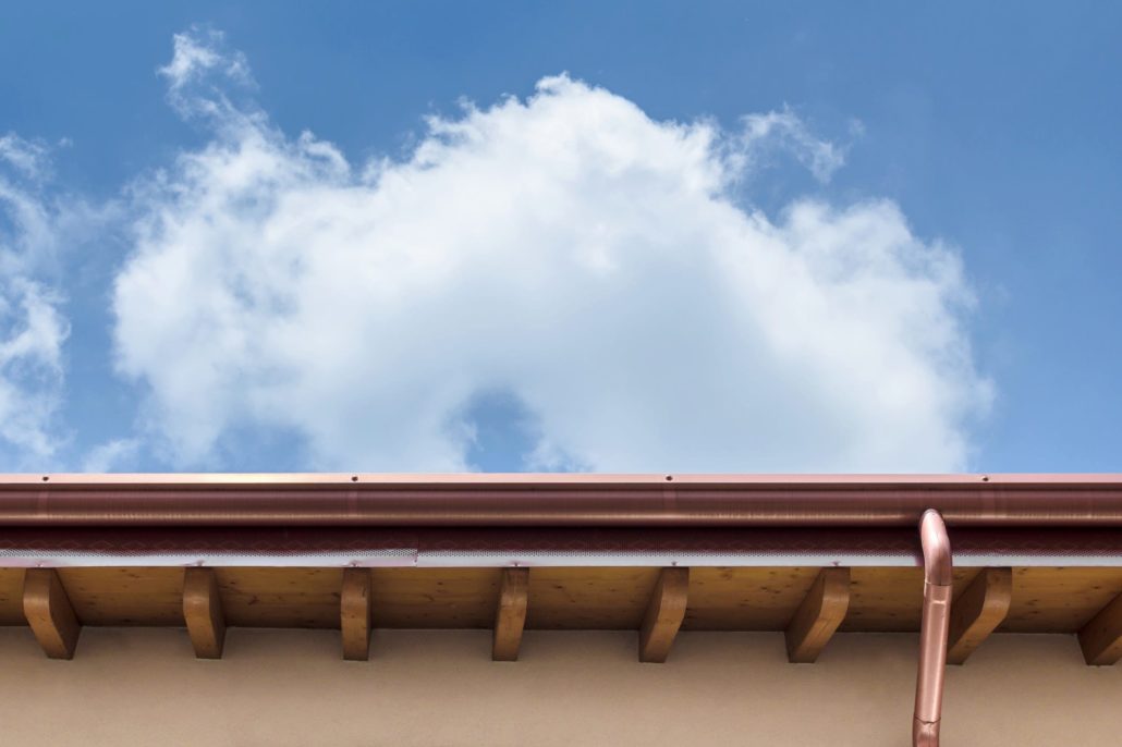 An underside view of a home’s copper seamless gutters.