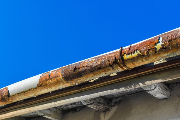 Rusty, corroded gutters on a home.