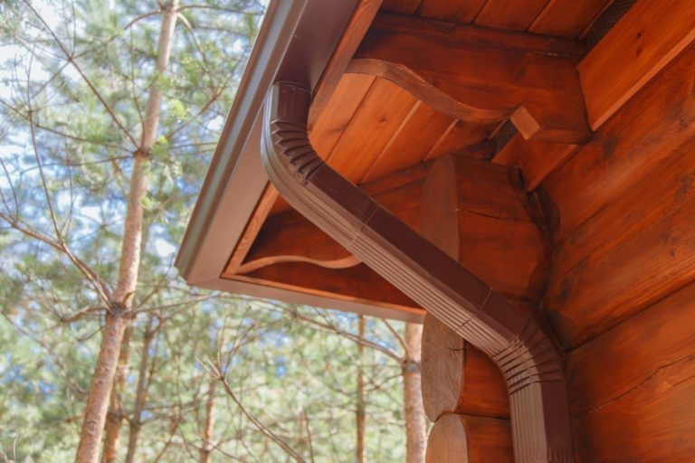 Copper gutters on a log cabin home.