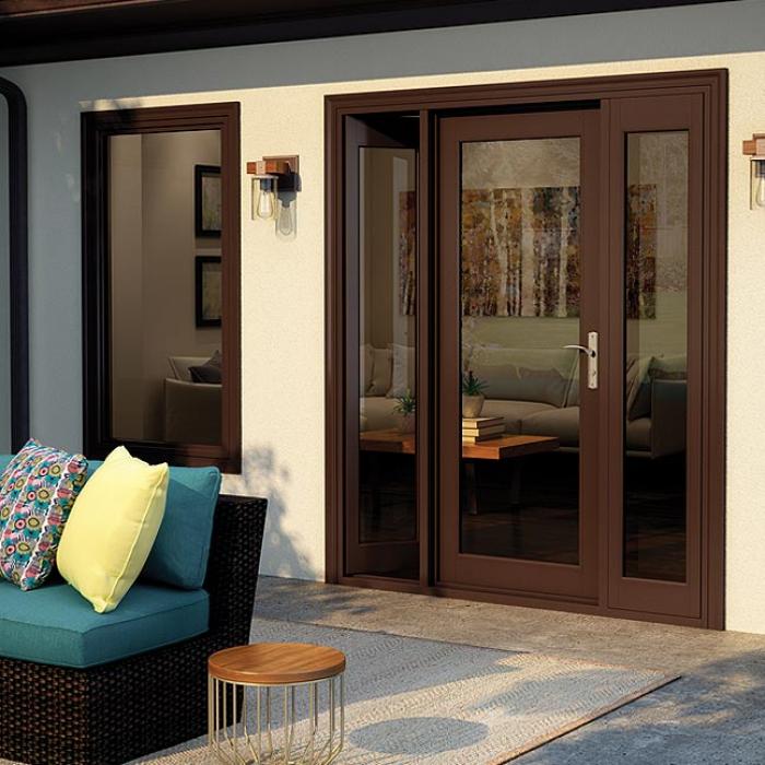 A glass hinged patio door with brown trim.