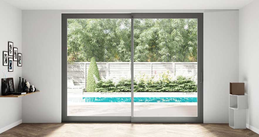 Glass sliding patio doors leading to an inground pool from the interior of the home.