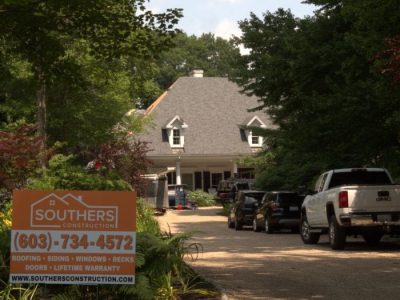 A Southers Construction sign placed next to the driveway of a home in West Newbury, MA.