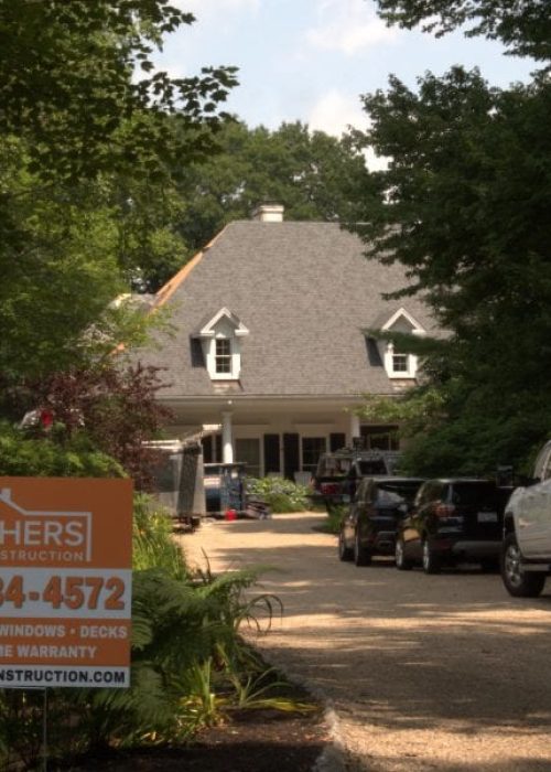 A Southers Construction sign placed next to the driveway of a home in West Newbury, MA.