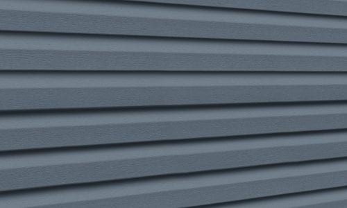 Dark blue Premium Pointe vinyl siding panels.